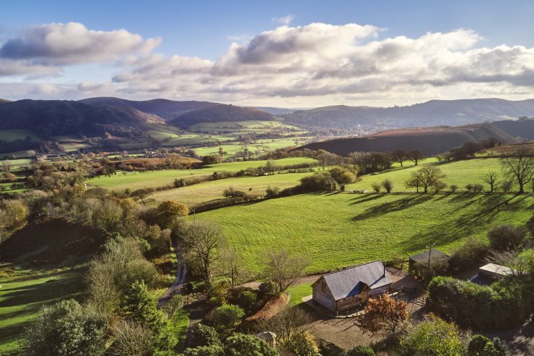 Countryside view across the green Shropshire Hills area of outstanding natural beauty