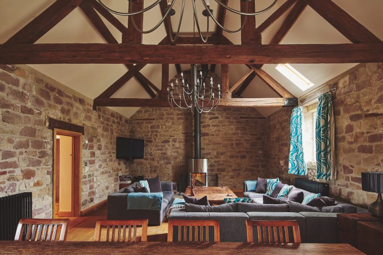 Living Room With Log Burner at Woodpecker Loft in Ashbourne Peak District