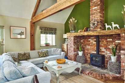 The living room with log burner at The Luxury Barn, Peak District