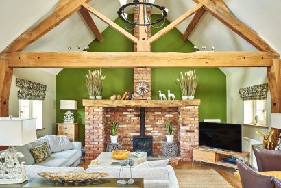 The living room with log burner at The Luxury Barn, Peak District