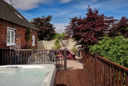 The hot tub and patio at The Luxury Barn, Peak District