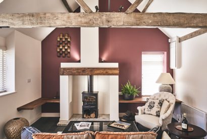 The living room with a log burner at The Stables, Cotswolds