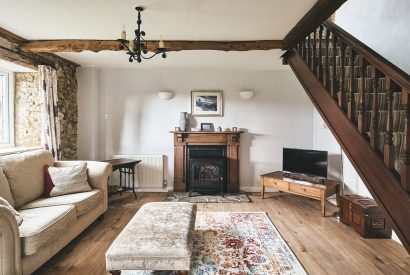 The living room with log burner at Blackdown Cottage, Devon