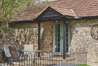The exterior and door way of Harcombe Cottage, Devon