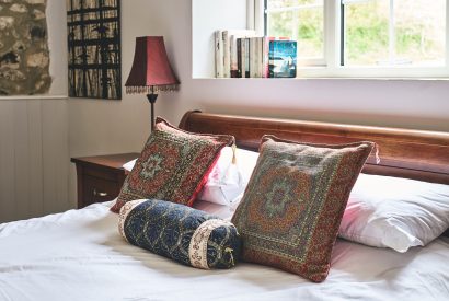 A double bed at Harcombe Cottage, Devon
