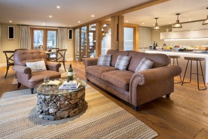 The open plan living room and kitchen at Thresher's Cottage, Lake District