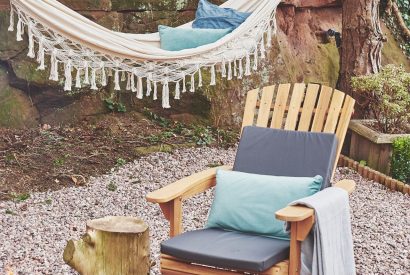 The outdoor seating area with hammock at Hidden Orchard, Cheshire