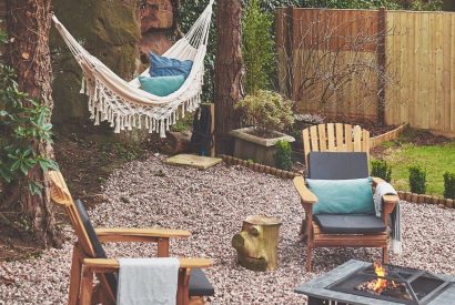 The outdoor fire pit and seating area at Hidden Orchard, Cheshire