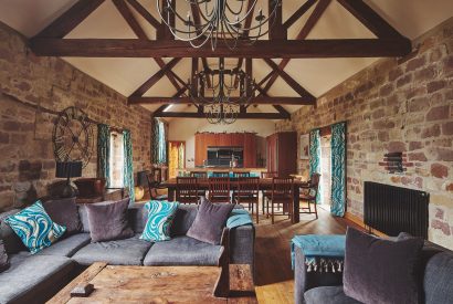 The open plan living room and kitchen at Woodpecker Loft, Peak District