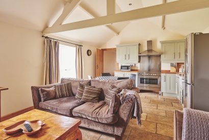 The living room and kitchen at Barn Owl Lodge, Peak District
