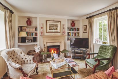 The living room with log burner at Wordsworth Cottage, Cotswolds