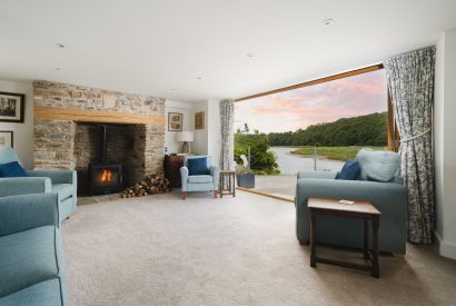 The living room with log burner at Riverside Retreat, Devon