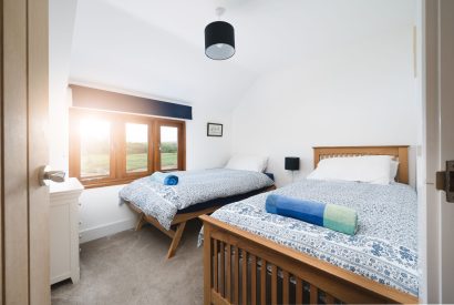 A twin bedroom at Riverside Retreat, Devon