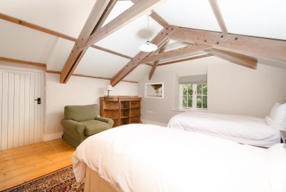 A twin bedroom at Honeycrisp Barn, Cornwall