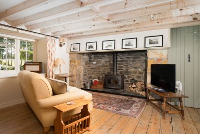 The living room with fireplace at Moon Cottage, Cornwall
