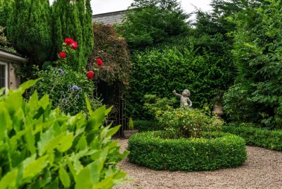 The private rose garden at Fig Tree Cottage, Cotswolds