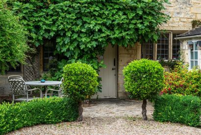 The back entrance to the property from the private rose garden at Fig Tree Cottage, Cotswolds 