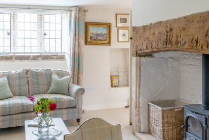 The two-seater sofa in the reception room at Fig Tree Cottage, Cotswolds