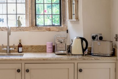The kettle and the toaster in the kitchen at Fig Tree Cottage, Cotswolds