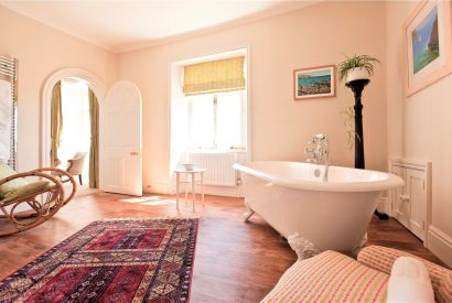A bathroom with free standing bath at Cornish Castle, Cornwall