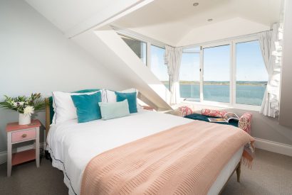 The master bedroom with views of the estuary at Waters Dream, Devon