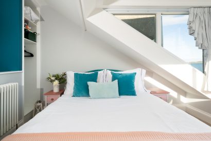 The master bedroom with views of the estuary at Waters Dream, Devon
