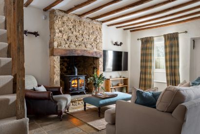 The living room with log burner at Upper Cottage, Cotswolds