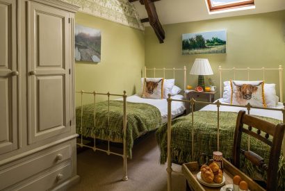 A twin bedroom at Honey Buzzard Farmhouse, Devon