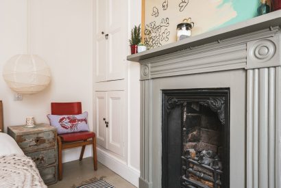 A double bedroom with fire place at 5 The Quay, Devon