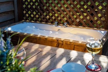 An outdoor bath at The Montana Cabin, Worcestershire