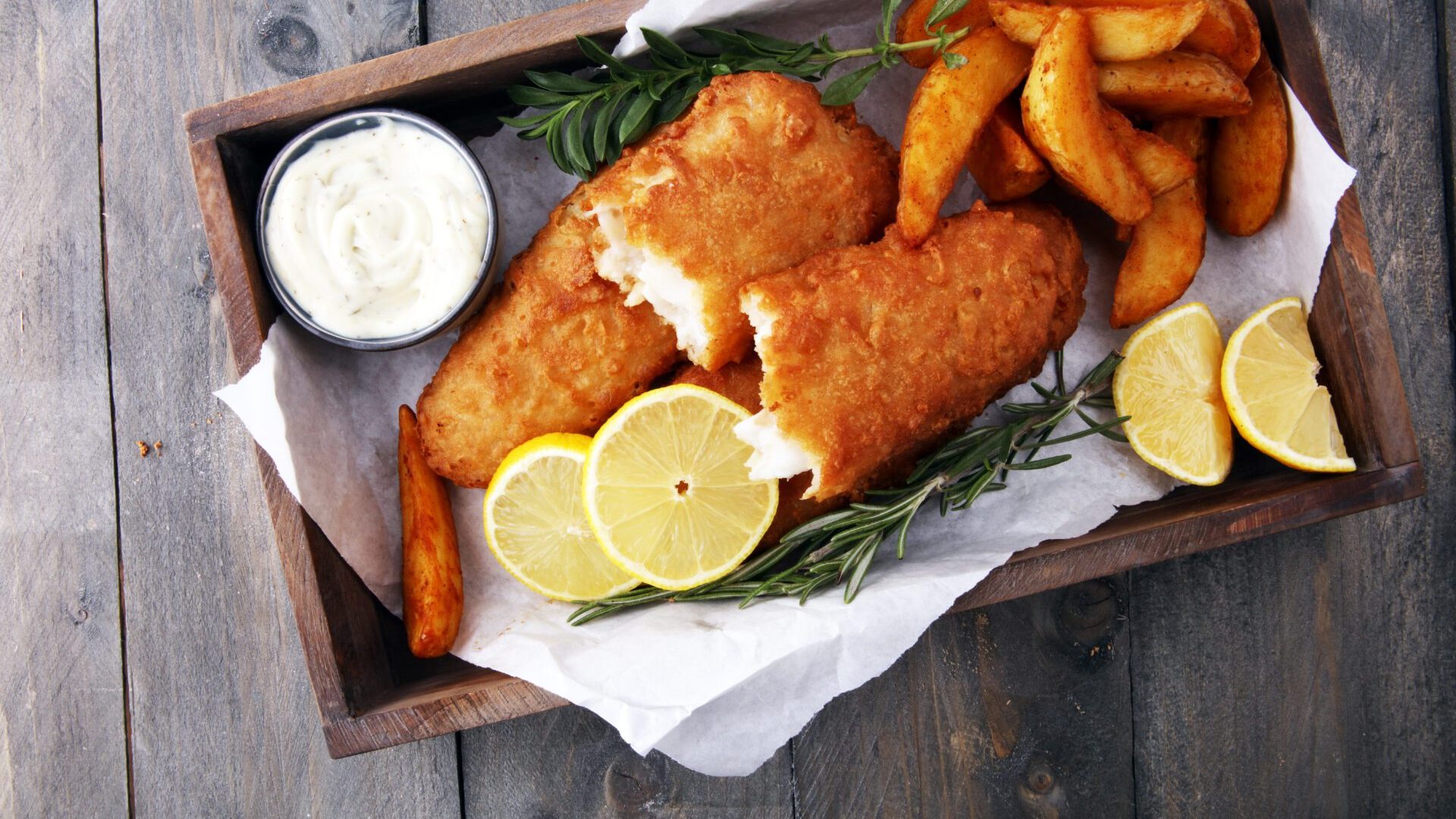 Traditional British Fish And Chips With Potato And Lemon