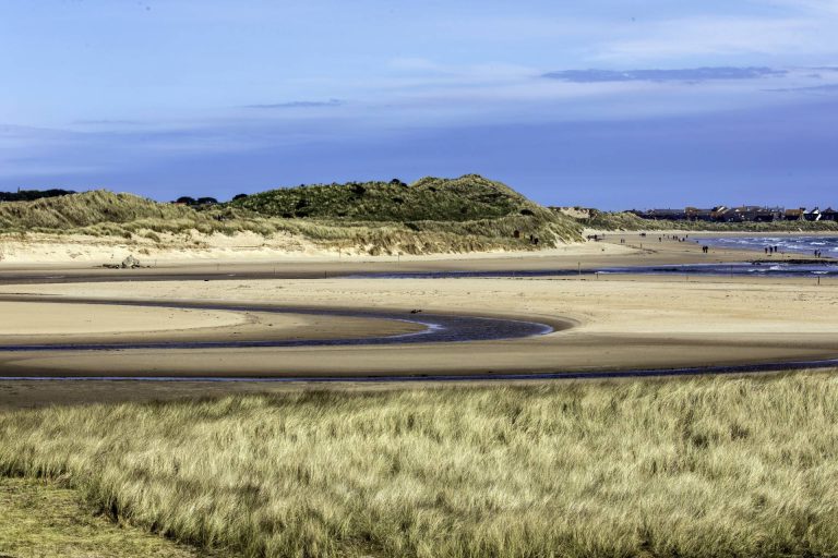 Sand dunes and the sea at Beadnell Beach