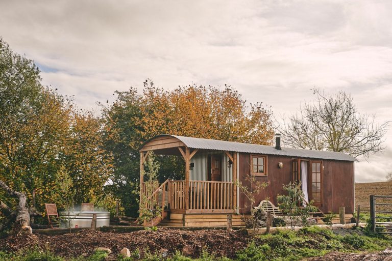 Outside of Big Sky Hideaway log cabin in Herefordshire with handcrafted hot tub