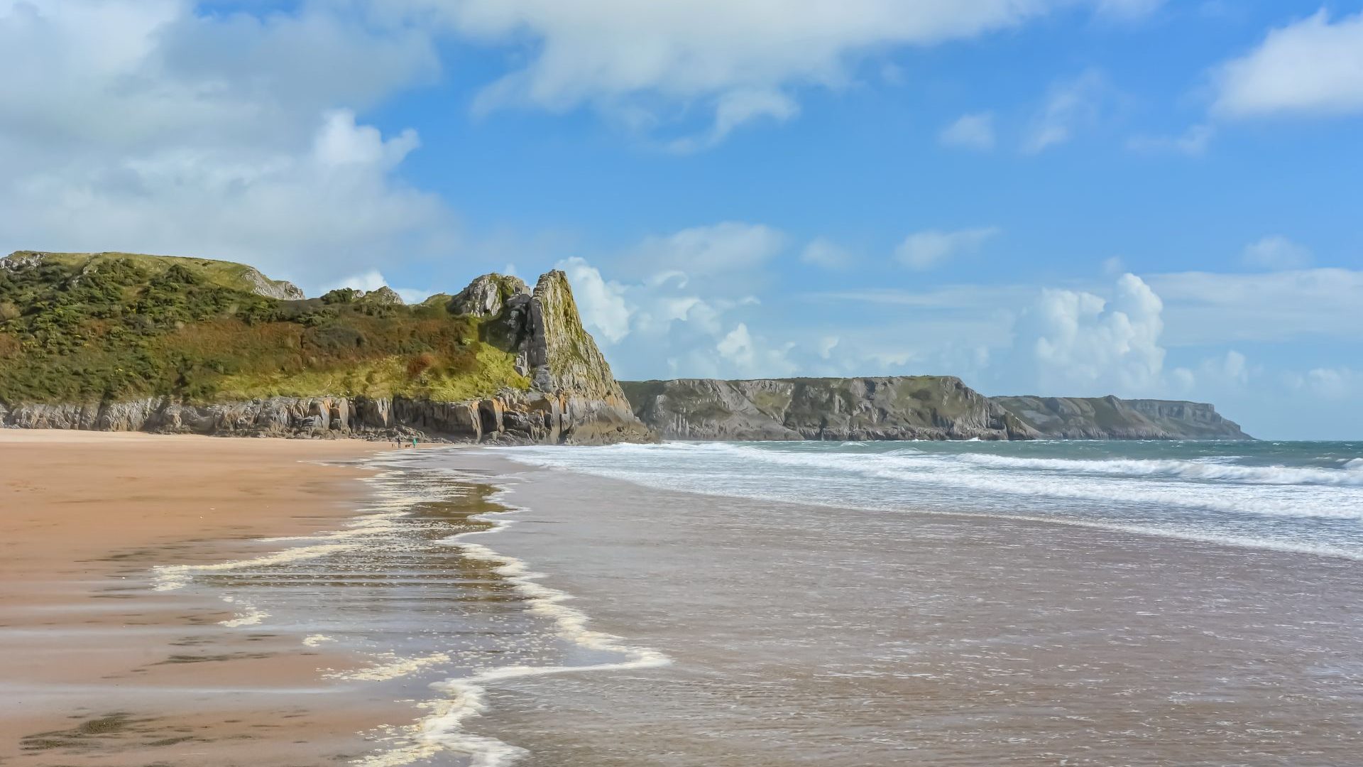 Sands and cliffs at the Eastern End Of Oxwich Bay Beach On The Gower Peninsula In Wales