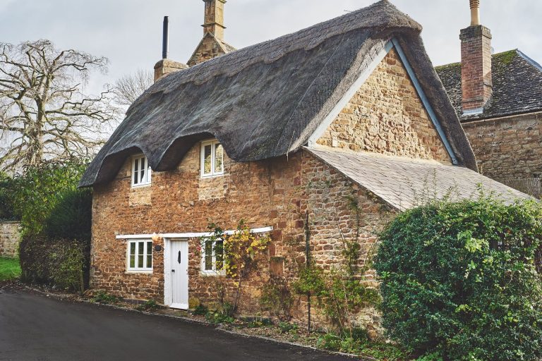 A cottage in the Cotswolds with a thatched roof
