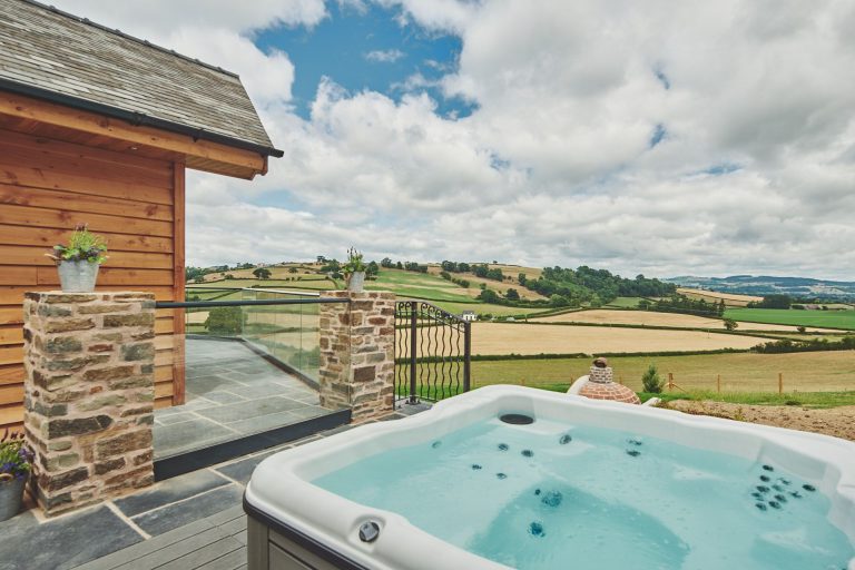 Hot Tub With View Of Countryside From Upper Tumble Cottage In Powys