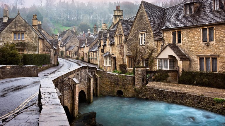 Row of houses along the stream at Castle Combe, Cotswolds