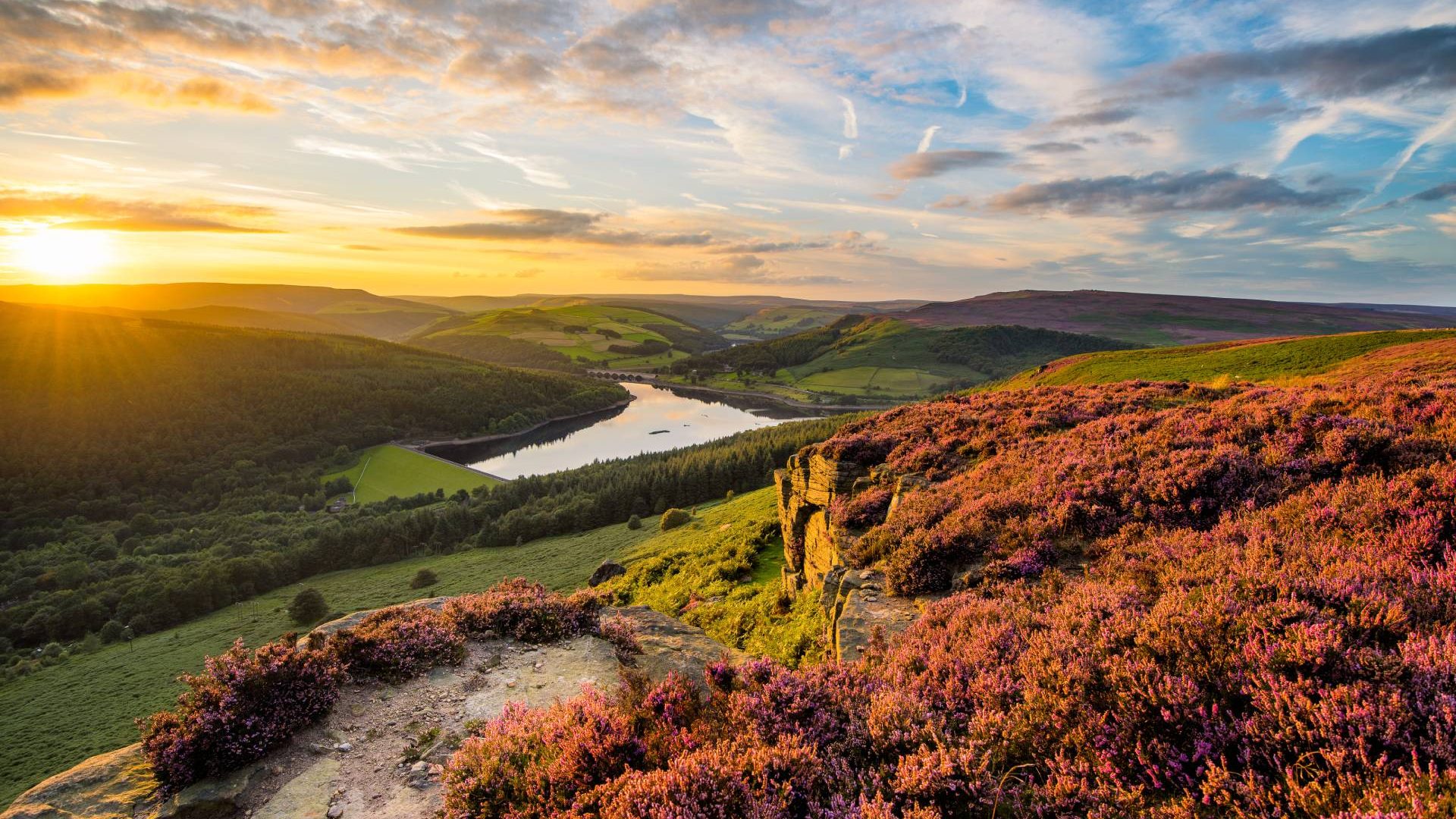 Sunset over the hills and lake in the Peak District