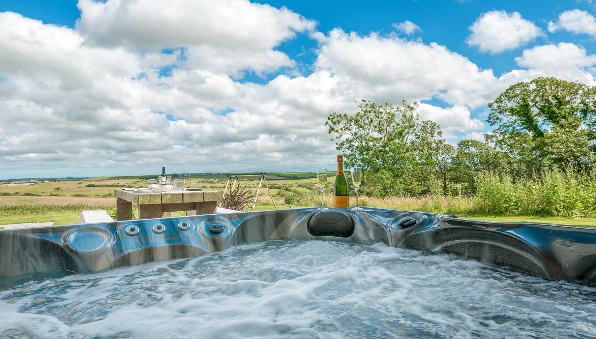 A hot tub with views over the countryside