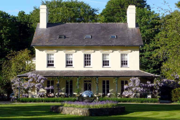 The exterior of a manor in Llyn Peninsula, Wales on a sunny day