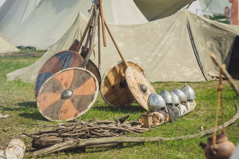 Shields And Helmet Among Tents On A Viking Festival