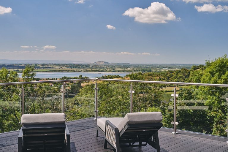 Two Sunloungers On Terrace At Reservoir View Overlooking The Cheddar Valley In Somerset