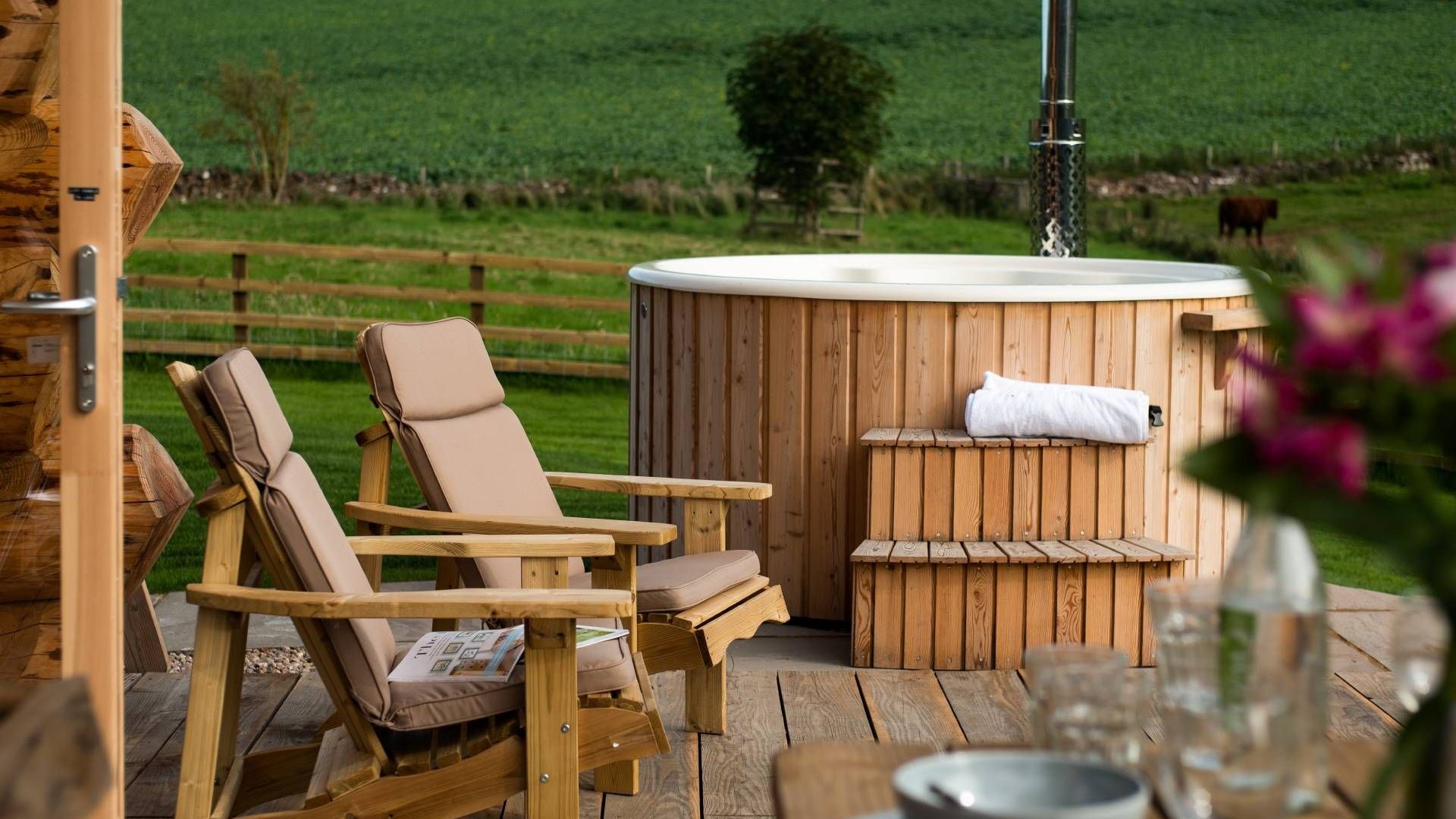 Hot tub and deck chairs overlooking the countryside