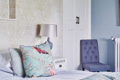 A bedroom with blue decor at Equestrian Manor, Malvern Hills
