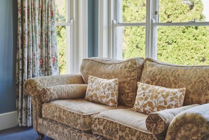 A floral sofa at Equestrian Manor, Malvern Hills