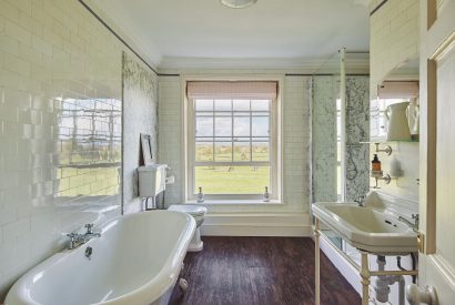 A bathroom with countryside views at Equestrian Manor, Malvern Hills