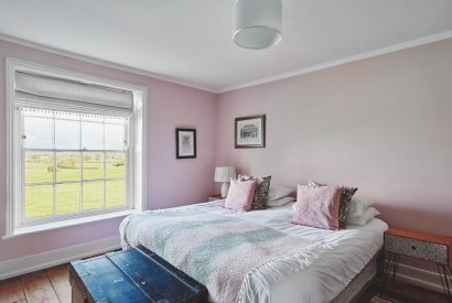 A pink bedroom at Equestrian Manor, Malvern Hills