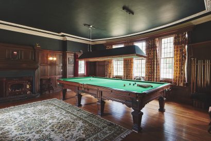 A games room with snooker table at Equestrian Manor, Malvern Hills
