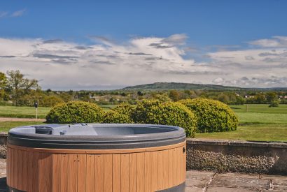 The hot tub and countryside views at Equestrian Manor, Malvern Hills