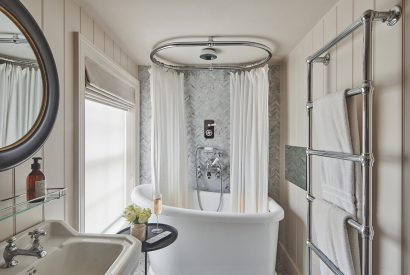 A bathroom with roll top bath at Harold House, Isle of Wight
